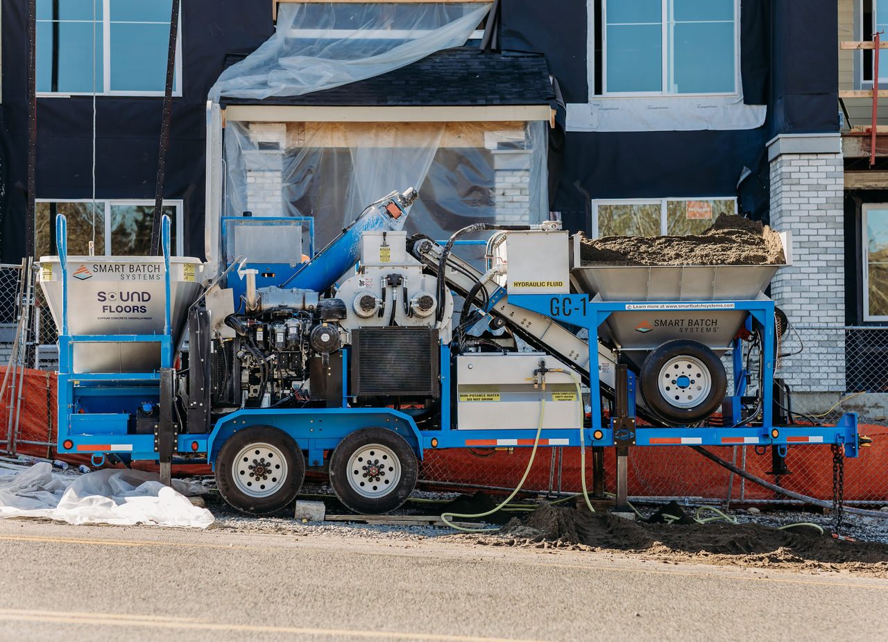 Full side profile of the Smart Batch GC-1 rig parked at the building