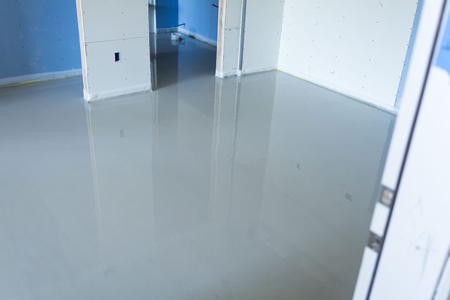 Freshly poured self-leveling floor with a glass-flat reflective sheen