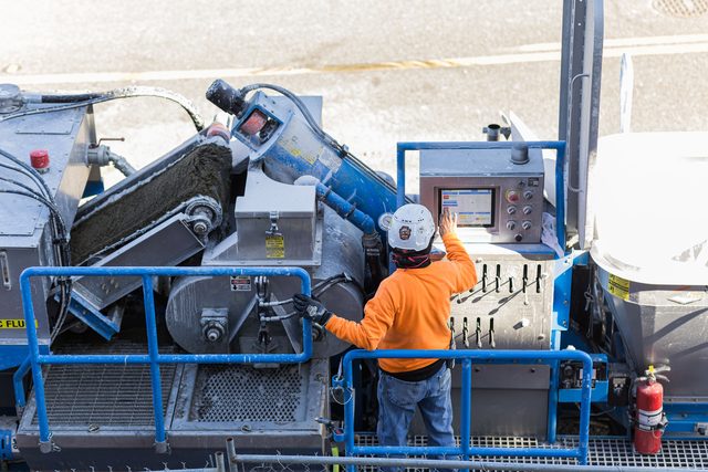 Operator running the Smart Batch touchscreen batch-control panel